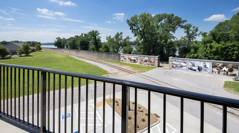 Deck with water view near train 