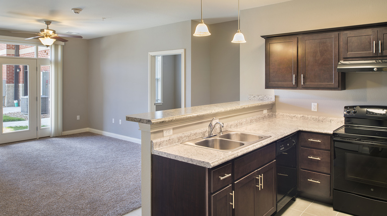 Open concept floorplan with bar seating in kitchen